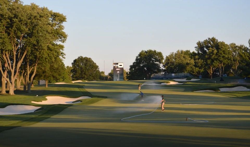 Crew and officials working around bunkers during tournament play