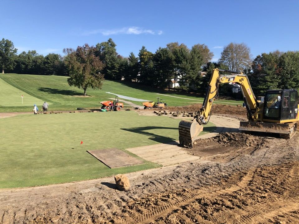 Excavation and sod staging during a green surface reconstruction