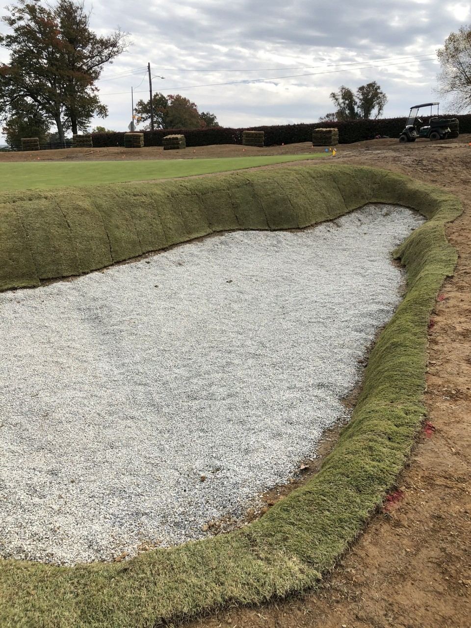 Completed bunker base with drainage gravel and new sod edging
